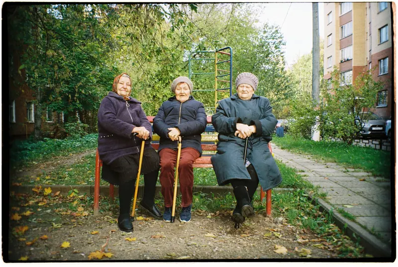 Three residents out for a walk with their canes