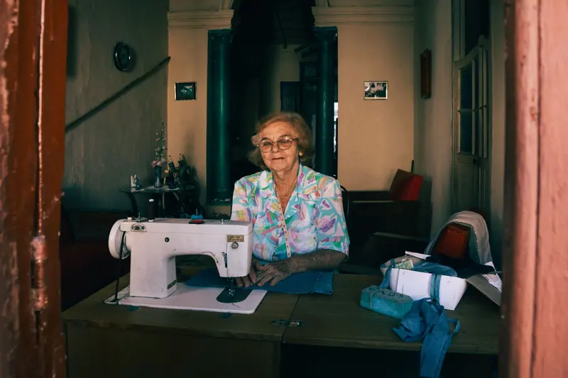 Mending by the window