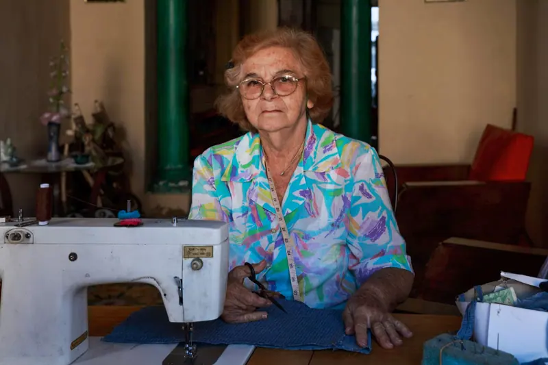 A member at the sewing machine in the craft room