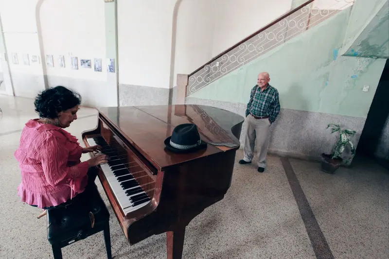 A resident playing the lobby piano