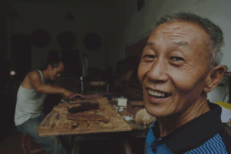 A member grinning in the shop