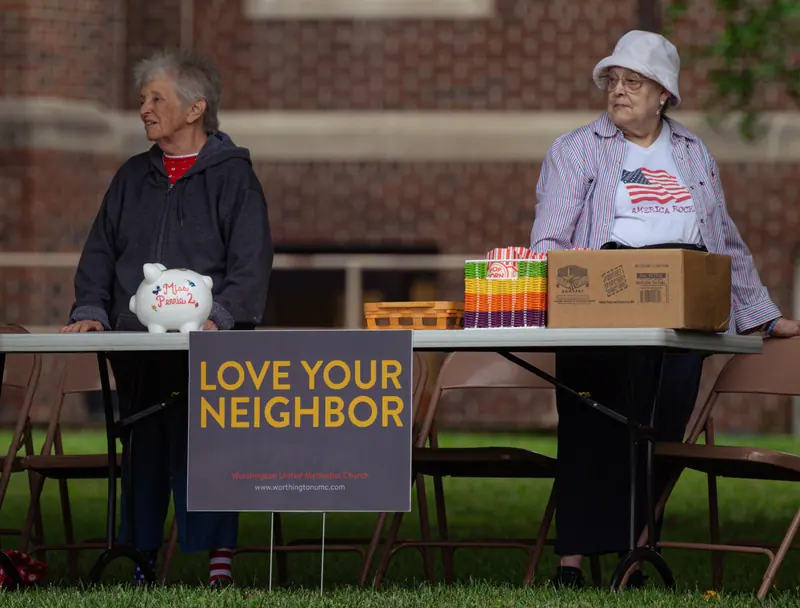 Residents at the church bake sale table