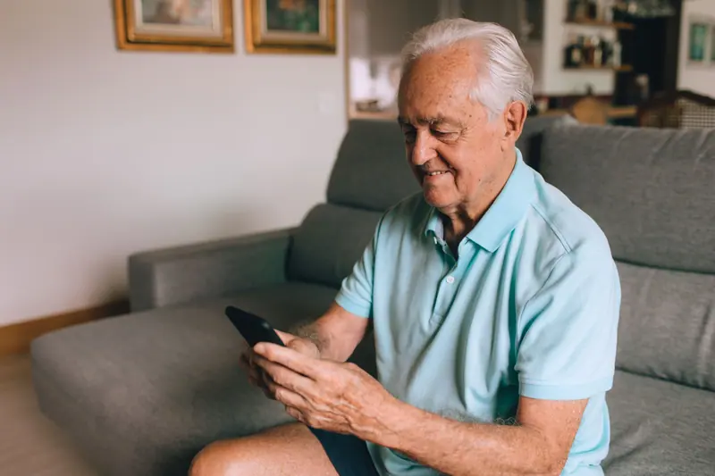 A resident reading a text from his son