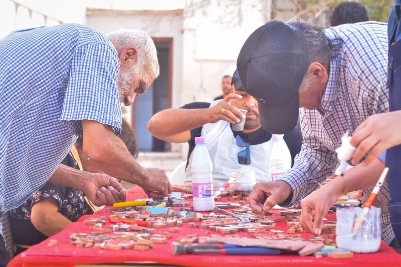 Residents and volunteers at the craft table