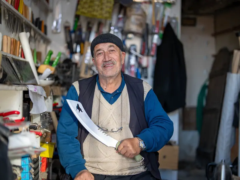 A resident in his old machine shop on a family outing