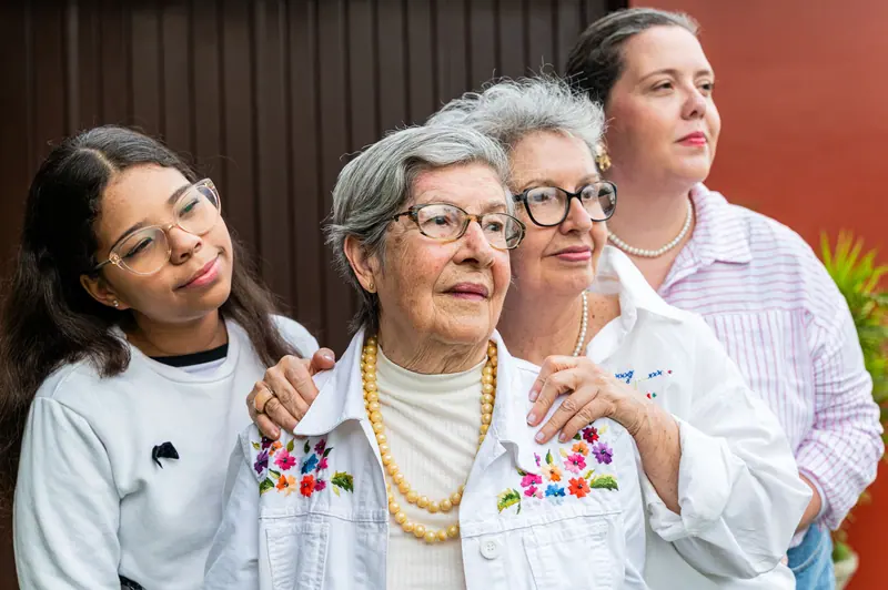 A member with her daughter and granddaughter on visiting day