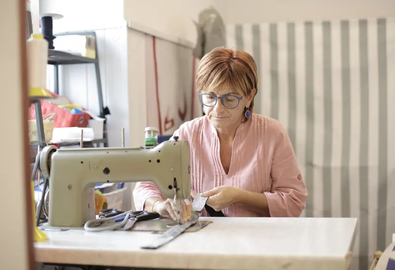 At the sewing machine