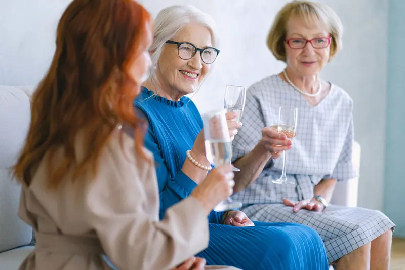 Three friends toasting a birthday