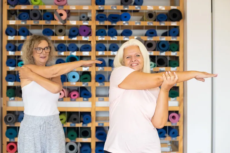 A stretching class with the therapy aides