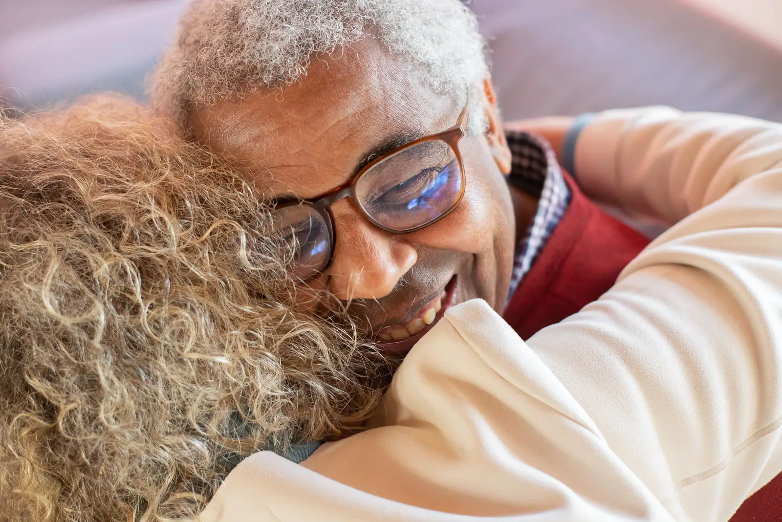 A member hugging his daughter at afternoon pickup