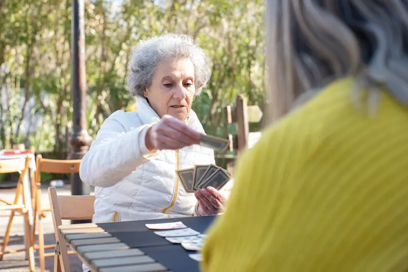 A resident sharing a laugh on the patio
