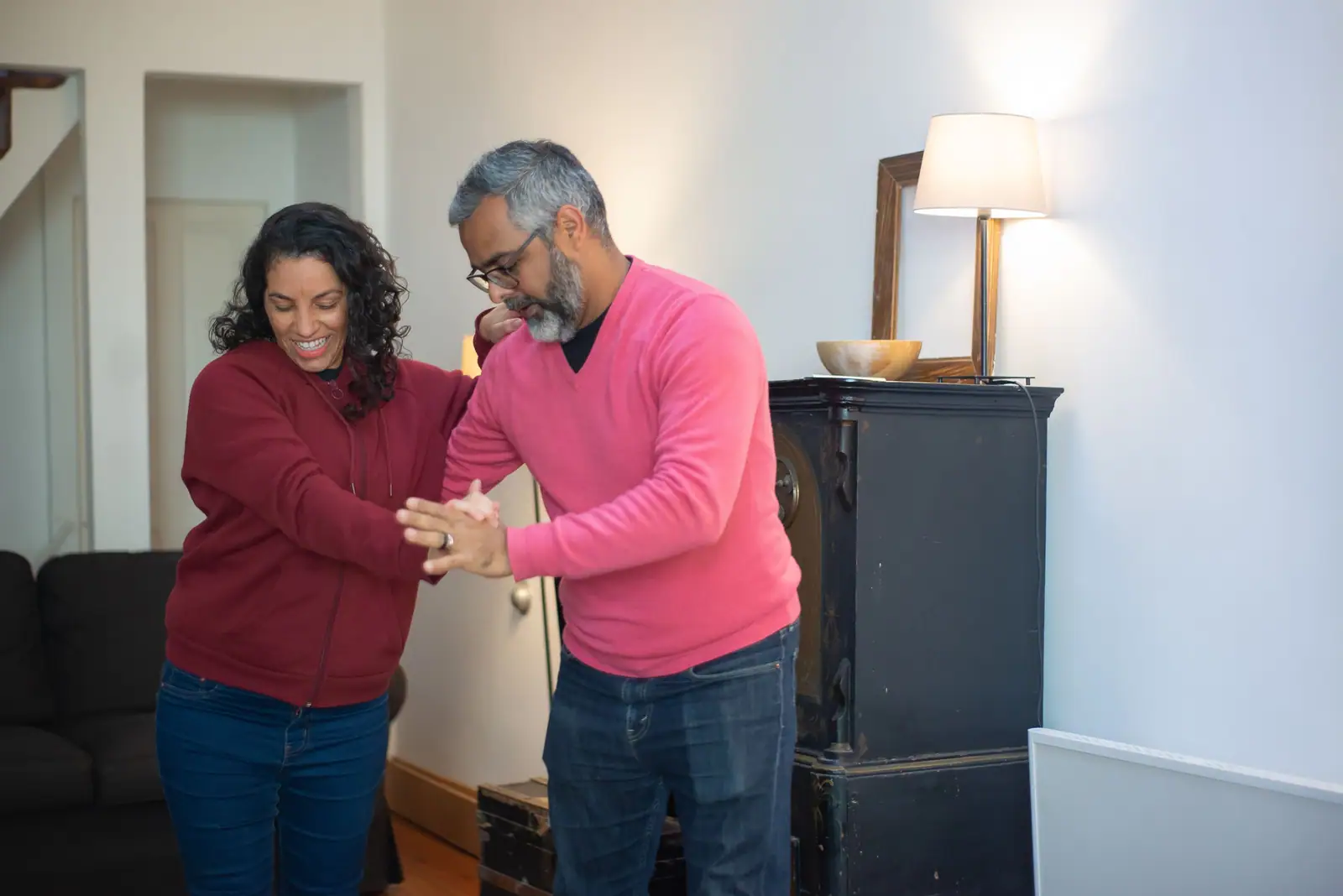 A member and his wife dancing together in the club lounge