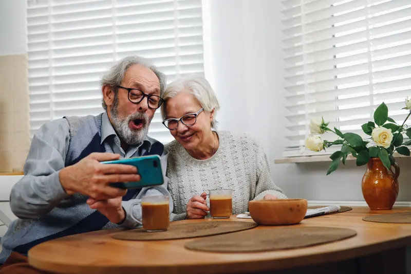 A couple sharing tea and a laugh