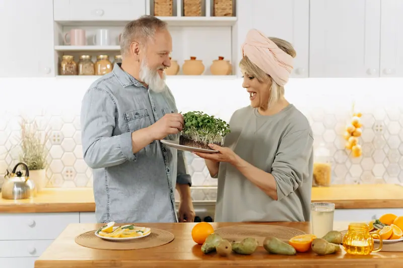 A couple cooking supper together