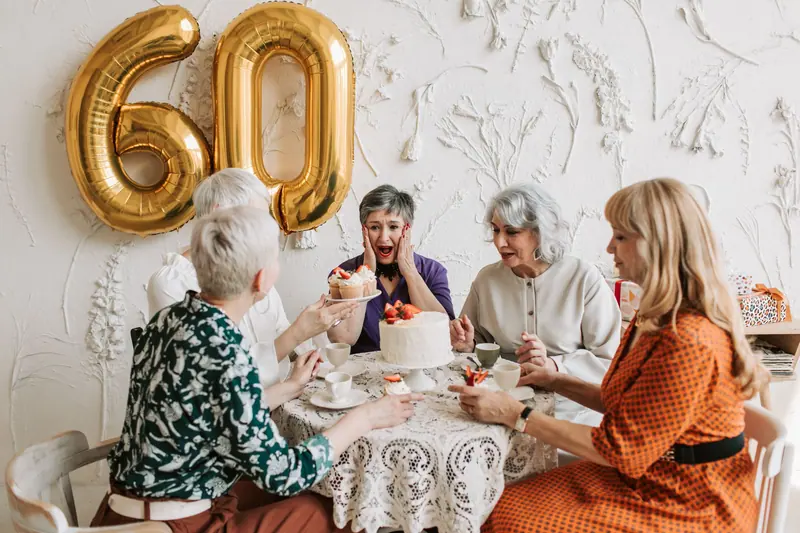An anniversary tea with gold balloons