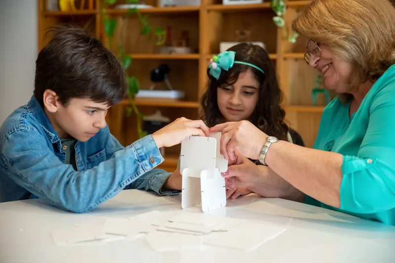 Preschoolers from next door at the craft table