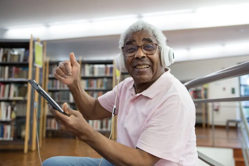 A member listening to his playlist at the computer bar