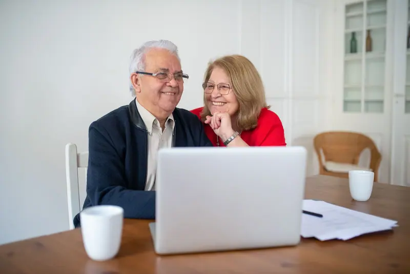 A couple reading their grandson's email