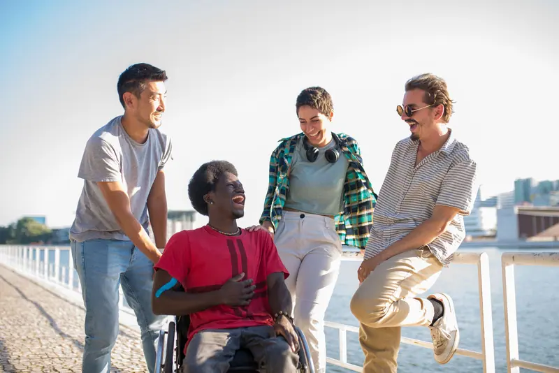 A walk along the water, one member in her wheelchair