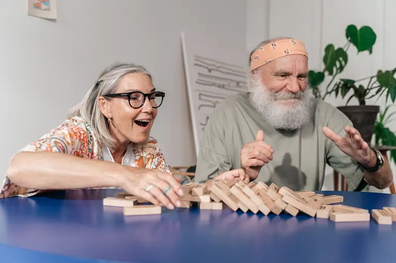 A couple laughing over a game