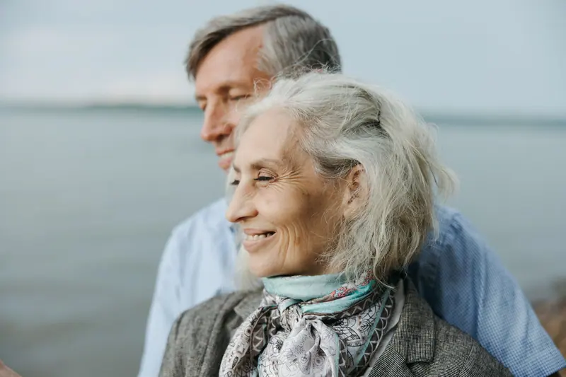 A couple at the water's edge