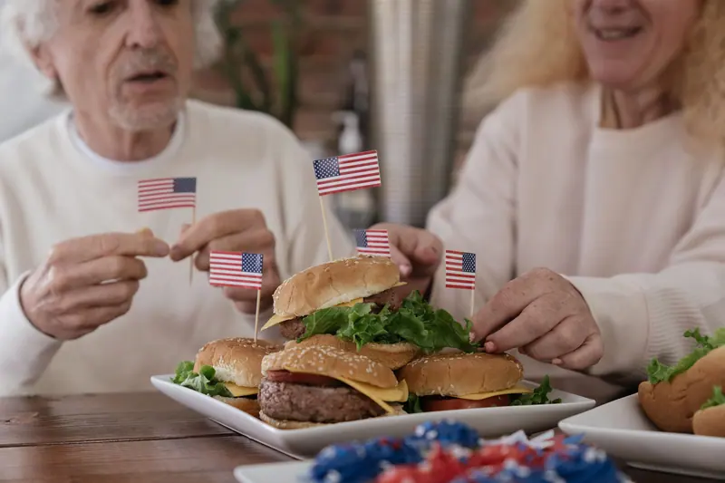 Burgers and little flags at the Fourth of July cookout