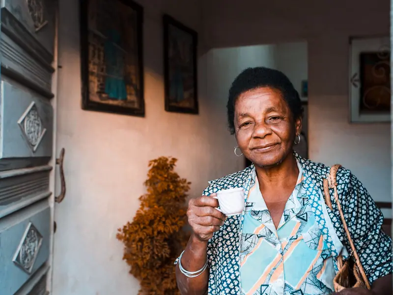 A resident with her cup of coffee