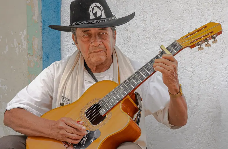 A resident playing guitar