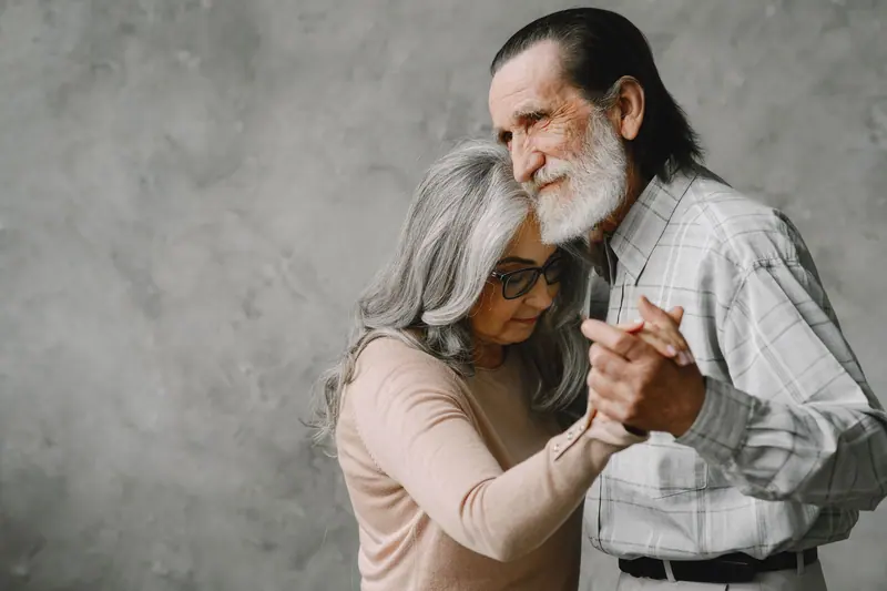 A couple dancing in the community room