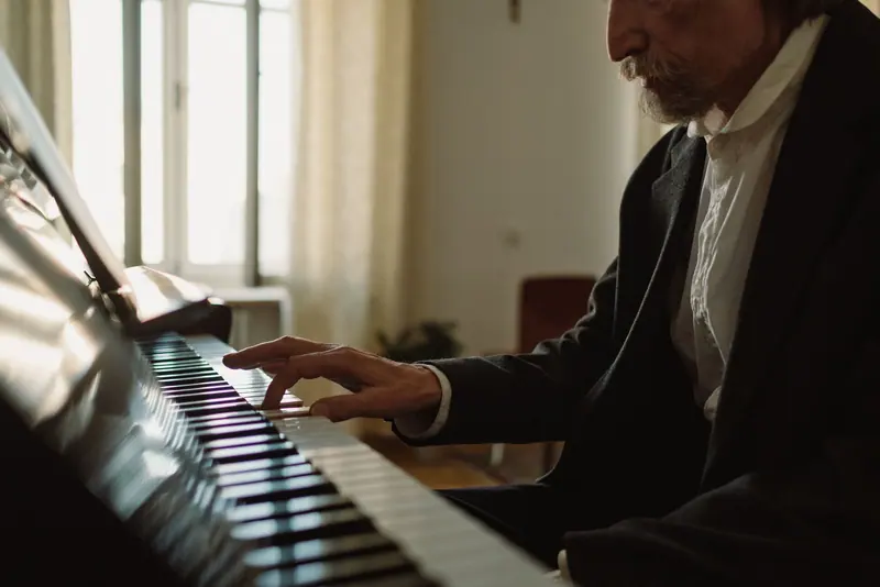A resident at the piano in the music room