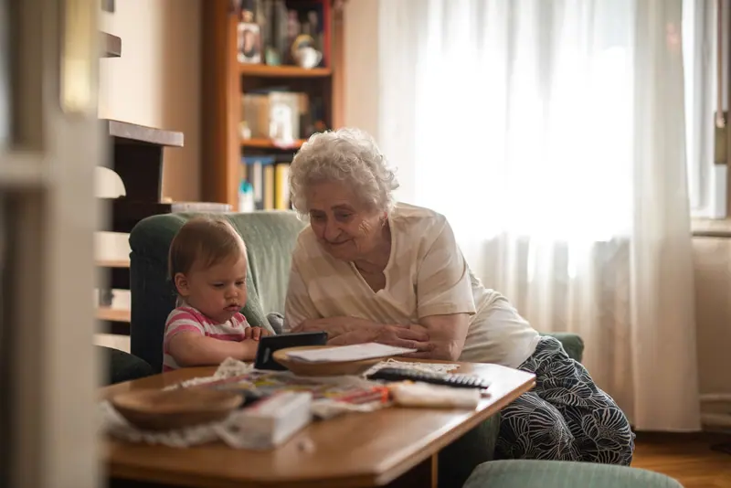 A great-grandmother with the baby