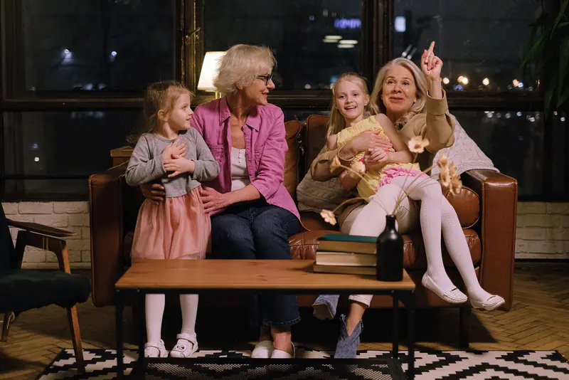 Two grandmothers with their granddaughters