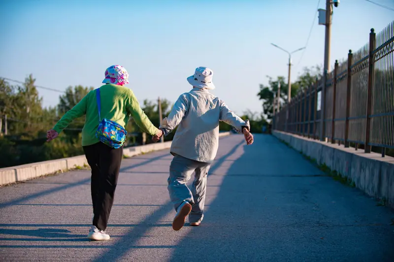 A couple walking hand in hand