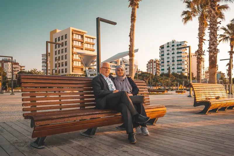 A couple on a park bench