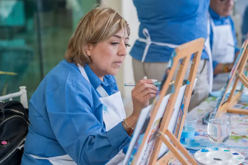 A resident painting in the art studio