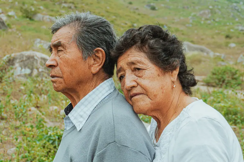 A couple holding each other among the flowers