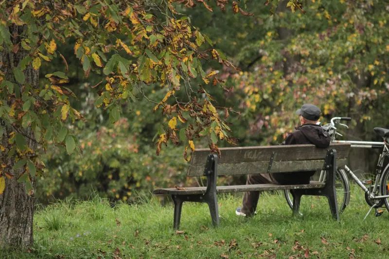 A resident on a bench along the trail