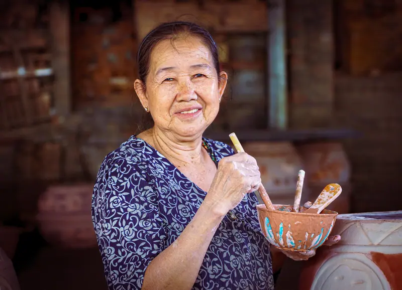A resident making pottery