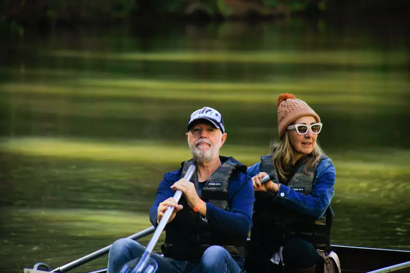 A couple rowing on the lake