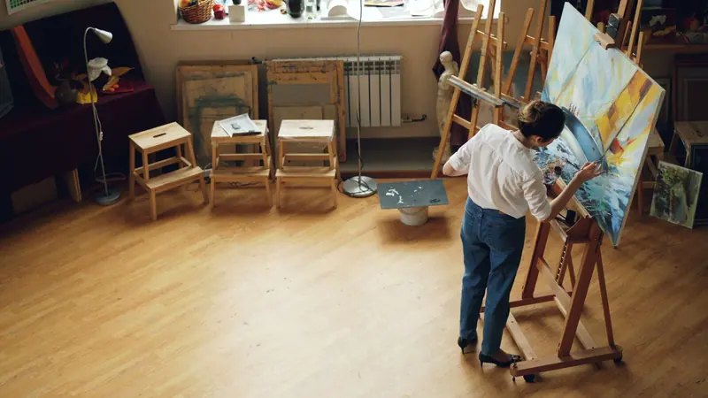 A resident painting in the art studio