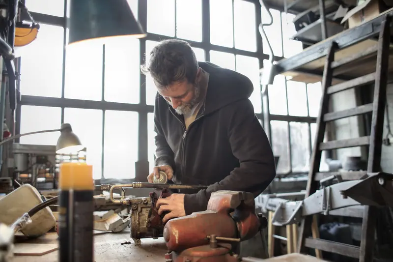 A resident at work in the woodshop