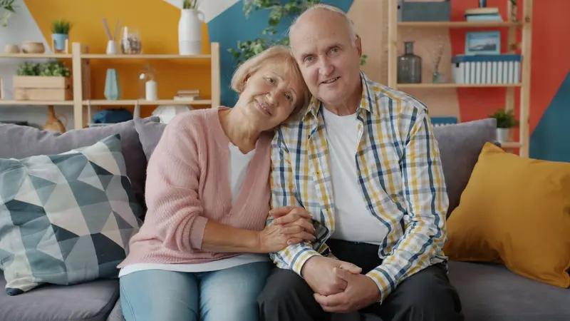A couple relaxing on the sofa at home