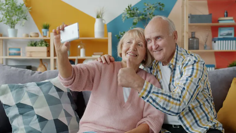 A couple taking a selfie at home