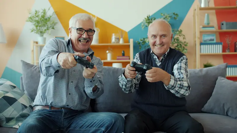 Two friends competing at a game in the clubhouse
