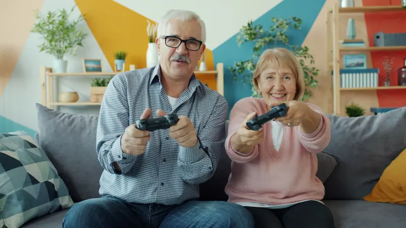 A couple playing video games at home