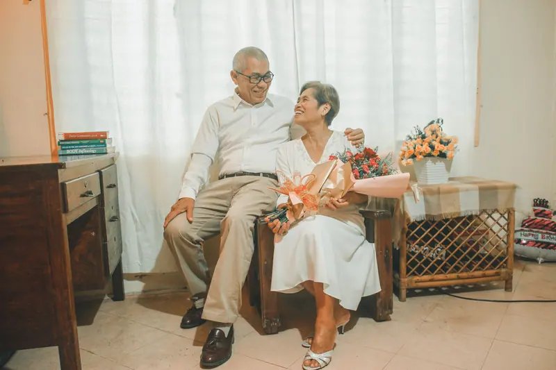A couple relaxing in the parlor armchairs