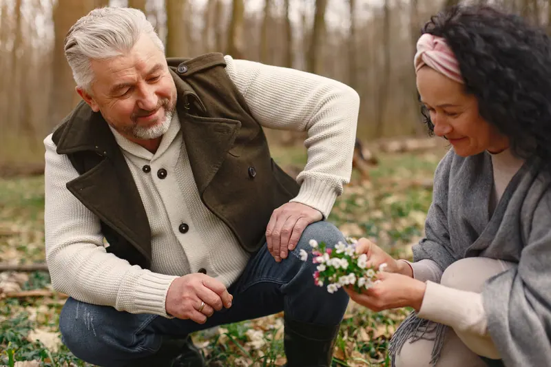 A couple picking spring wildflowers