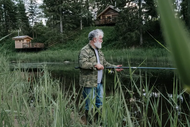 A resident casting a line from the reeds along the shore
