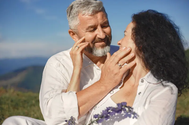 A couple sharing a tender moment outdoors