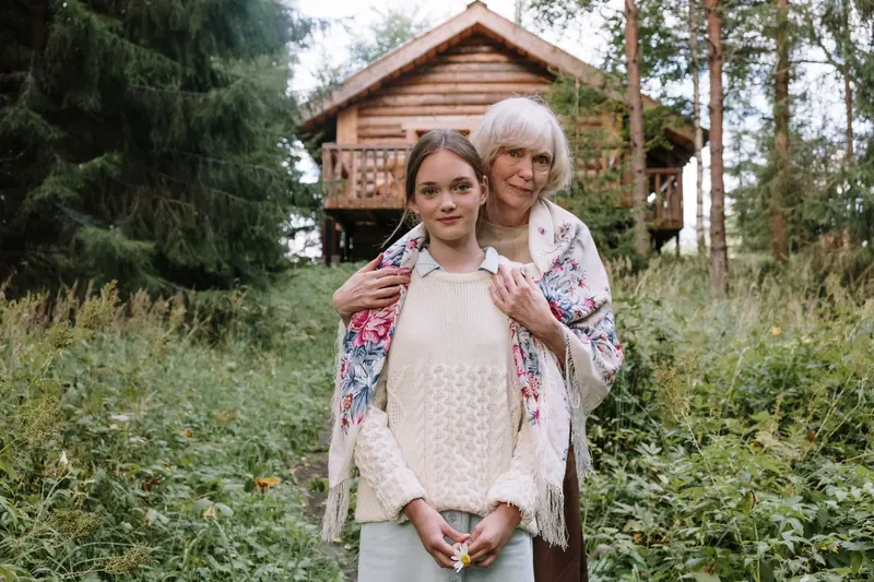 A grandmother and granddaughter in the woods